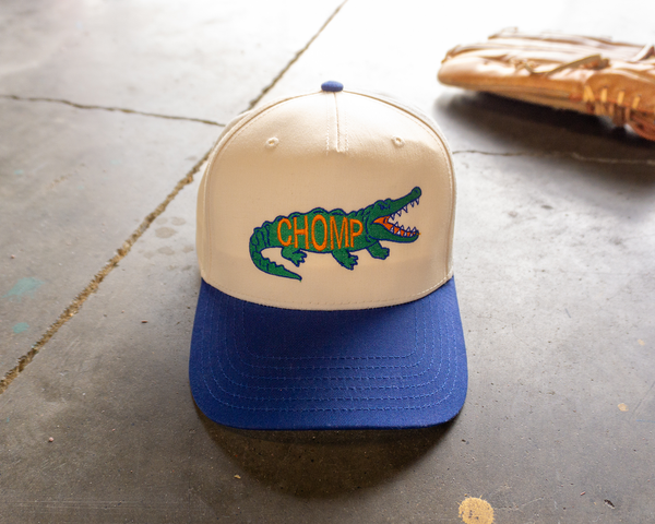 Two-tone snapback hat with CHOMP text and gator design, Florida football inspired